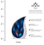 Bright Blue Blue Cremation Urn angled view of lid and engraved motif - smooth teardrop contour featuring blue art - mini keepsake memorial for portion of cremation ashes