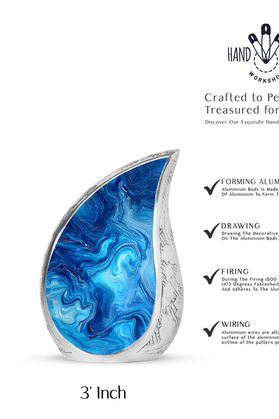 Sea Green Teal Blue Cremation Urn angled view of lid and engraved motif - rounded teardrop blue design with delicate detail - mini keepsake memorial for portion of cremation ashes