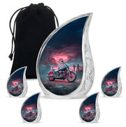 Bright Blue Bike Cremation Urn side profile showing urn shape - graceful tear-shaped urn with bike motif - memorial set with one large and four small urns