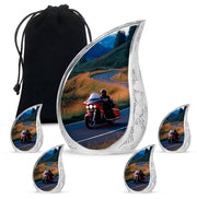 Cornflower Blue Bike Cremation Urn side profile showing urn shape - graceful tear-shaped urn with bike motif - memorial set with one large and four small urns
