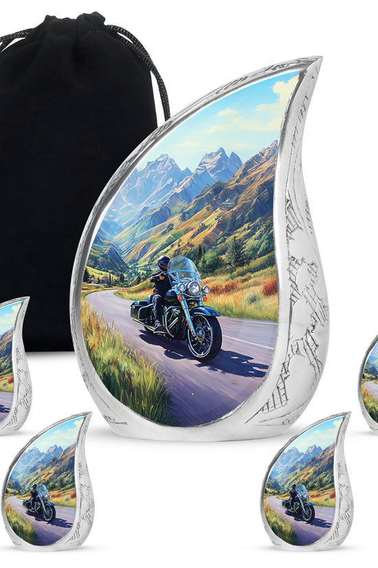 Powder Blue Bike Cremation Urn side profile showing urn shape - flowing teardrop bike silhouette on curved aluminum - memorial set with one large and four small urns