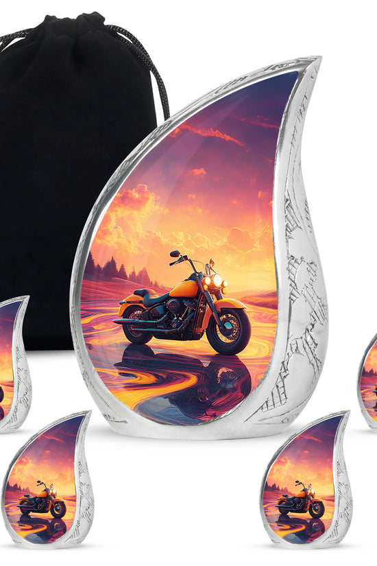 Peony Pink Bike Cremation Urn side profile showing urn shape - rounded teardrop bike design with delicate detail - memorial set with one large and four small urns