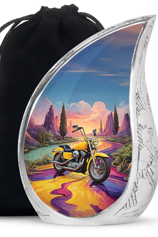 Sky Blue Bike Cremation Urn front view showing detailed design - flowing teardrop bike silhouette on curved aluminum - full-size 10 inch 200 cubic inch adult cremation urn