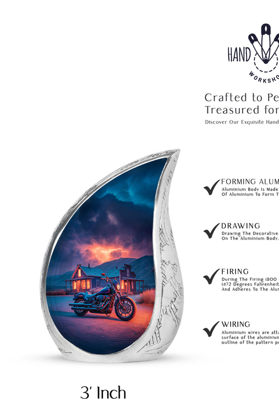 Cornflower Blue Bike Cremation Urn angled view of lid and engraved motif - smooth teardrop contour featuring bike art - mini keepsake memorial for portion of cremation ashes