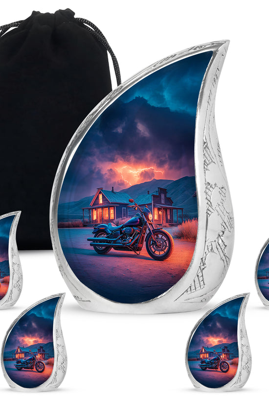Icy Blue Bike Cremation Urn side profile showing urn shape - flowing teardrop bike silhouette on curved aluminum - memorial set with one large and four small urns