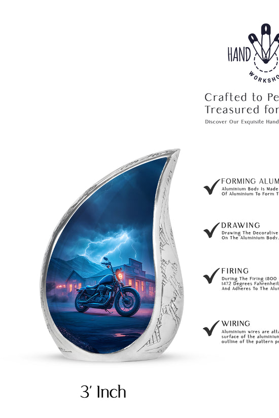 Calming Blue Bike Cremation Urn angled view of lid and engraved motif - graceful tear-shaped urn with bike motif - mini keepsake memorial for portion of cremation ashes