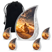 Matte Gold Bike Cremation Urn side profile showing urn shape - smooth teardrop contour featuring bike art - memorial set with one large and four small urns