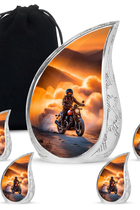 Burnished Gold Bike Cremation Urn side profile showing urn shape - smooth teardrop contour featuring bike art - memorial set with one large and four small urns