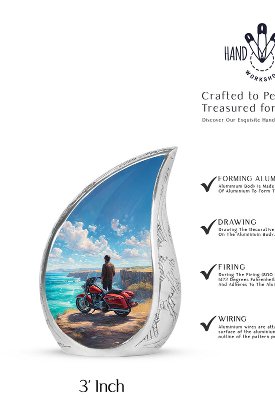 Royal Blue Bike Cremation Urn angled view of lid and engraved motif - graceful tear-shaped urn with bike motif - mini keepsake memorial for portion of cremation ashes