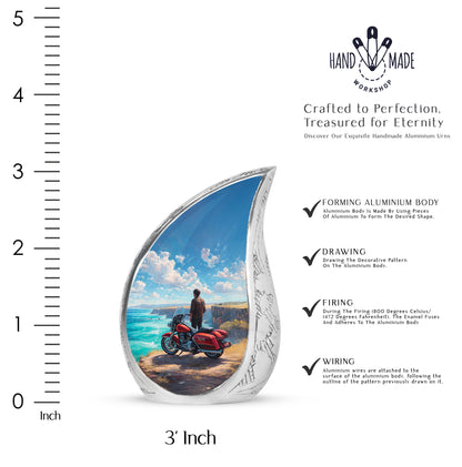 Royal Blue Bike Cremation Urn angled view of lid and engraved motif - graceful tear-shaped urn with bike motif - mini keepsake memorial for portion of cremation ashes