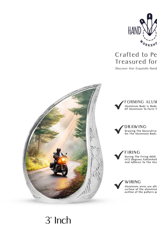 Amber Gold Bike Cremation Urn angled view of lid and engraved motif - flowing teardrop bike silhouette on curved aluminum - mini keepsake memorial for portion of cremation ashes