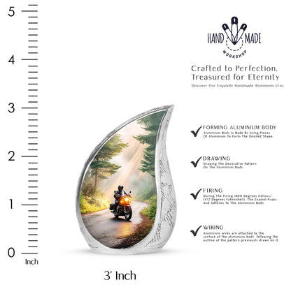 Amber Gold Bike Cremation Urn angled view of lid and engraved motif - flowing teardrop bike silhouette on curved aluminum - mini keepsake memorial for portion of cremation ashes