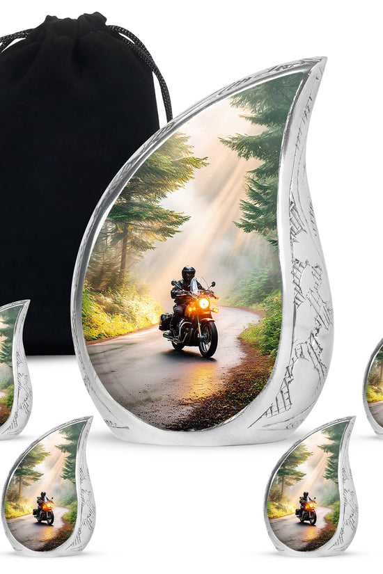Sunrise Gold Bike Cremation Urn side profile showing urn shape - rounded teardrop bike design with delicate detail - memorial set with one large and four small urns