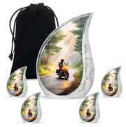 Sunrise Gold Bike Cremation Urn side profile showing urn shape - rounded teardrop bike design with delicate detail - memorial set with one large and four small urns