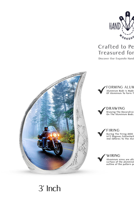 Sky Blue Bike Cremation Urn angled view of lid and engraved motif - rounded teardrop bike design with delicate detail - mini keepsake memorial for portion of cremation ashes