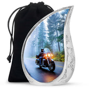 Indigo Bike Cremation Urn front view showing detailed design - flowing teardrop bike silhouette on curved aluminum - full-size 10 inch 200 cubic inch adult cremation urn
