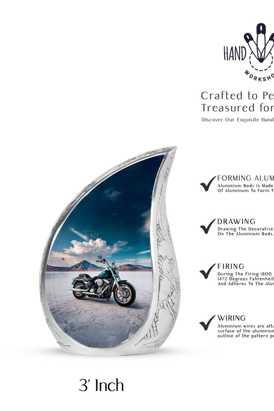 Calming Blue Bike Cremation Urn angled view of lid and engraved motif - smooth teardrop contour featuring bike art - mini keepsake memorial for portion of cremation ashes