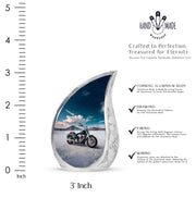 Calming Blue Bike Cremation Urn angled view of lid and engraved motif - smooth teardrop contour featuring bike art - mini keepsake memorial for portion of cremation ashes