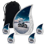 Royal Blue Bike Cremation Urn side profile showing urn shape - smooth teardrop contour featuring bike art - memorial set with one large and four small urns