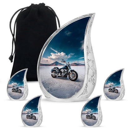 Royal Blue Bike Cremation Urn side profile showing urn shape - smooth teardrop contour featuring bike art - memorial set with one large and four small urns