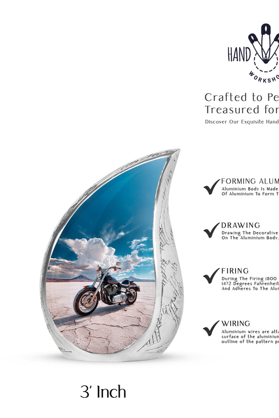 Misty Blue Bike Cremation Urn angled view of lid and engraved motif - rounded teardrop bike design with delicate detail - mini keepsake memorial for portion of cremation ashes