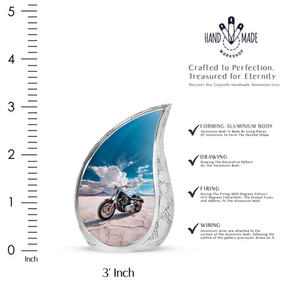 Misty Blue Bike Cremation Urn angled view of lid and engraved motif - rounded teardrop bike design with delicate detail - mini keepsake memorial for portion of cremation ashes