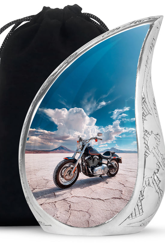 Azure Bike Cremation Urn front view showing detailed design - flowing teardrop bike silhouette on curved aluminum - full-size 10 inch 200 cubic inch adult cremation urn