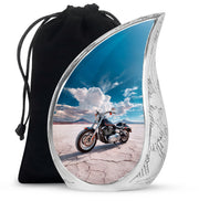 Azure Bike Cremation Urn front view showing detailed design - flowing teardrop bike silhouette on curved aluminum - full-size 10 inch 200 cubic inch adult cremation urn