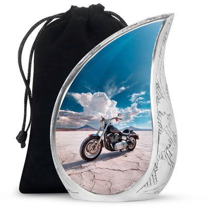Azure Bike Cremation Urn front view showing detailed design - flowing teardrop bike silhouette on curved aluminum - full-size 10 inch 200 cubic inch adult cremation urn