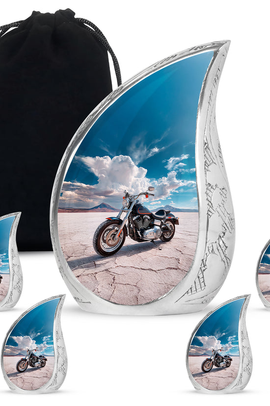 Navy Blue Bike Cremation Urn side profile showing urn shape - flowing teardrop bike silhouette on curved aluminum - memorial set with one large and four small urns