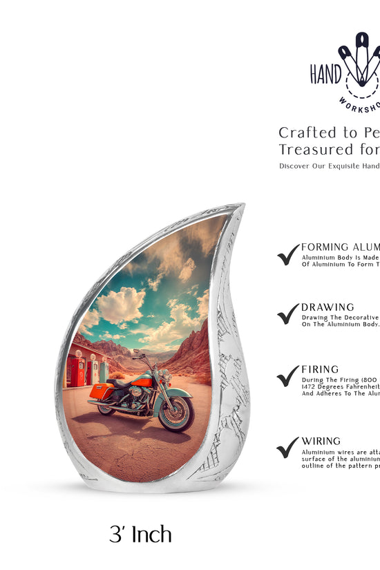 Jewel Teal Bike Cremation Urn angled view of lid and engraved motif - rounded teardrop bike design with delicate detail - mini keepsake memorial for portion of cremation ashes