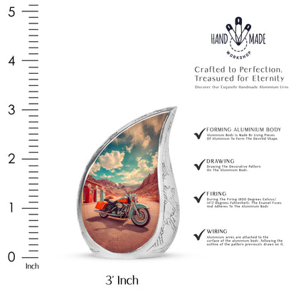 Jewel Teal Bike Cremation Urn angled view of lid and engraved motif - rounded teardrop bike design with delicate detail - mini keepsake memorial for portion of cremation ashes