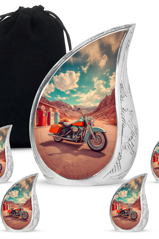 Mystic Teal Bike Cremation Urn side profile showing urn shape - graceful tear-shaped urn with bike motif - memorial set with one large and four small urns