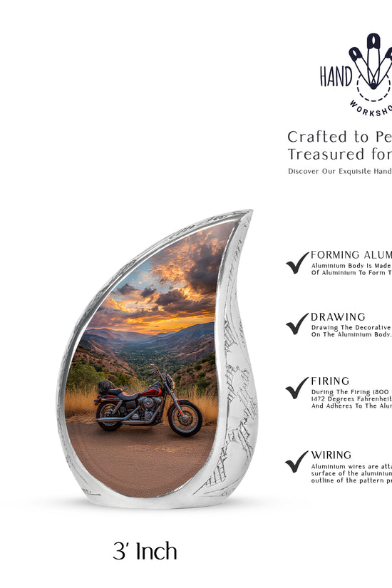 Cobalt Blue Bike Cremation Urn angled view of lid and engraved motif - graceful tear-shaped urn with bike motif - mini keepsake memorial for portion of cremation ashes