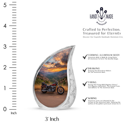 Cobalt Blue Bike Cremation Urn angled view of lid and engraved motif - graceful tear-shaped urn with bike motif - mini keepsake memorial for portion of cremation ashes