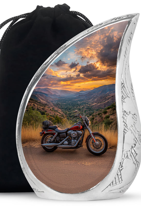 Navy Blue Bike Cremation Urn front view showing detailed design - flowing teardrop bike silhouette on curved aluminum - full-size 10 inch 200 cubic inch adult cremation urn