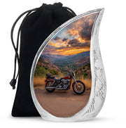 Navy Blue Bike Cremation Urn front view showing detailed design - flowing teardrop bike silhouette on curved aluminum - full-size 10 inch 200 cubic inch adult cremation urn