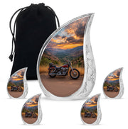 Cornflower Blue Bike Cremation Urn side profile showing urn shape - graceful tear-shaped urn with bike motif - memorial set with one large and four small urns