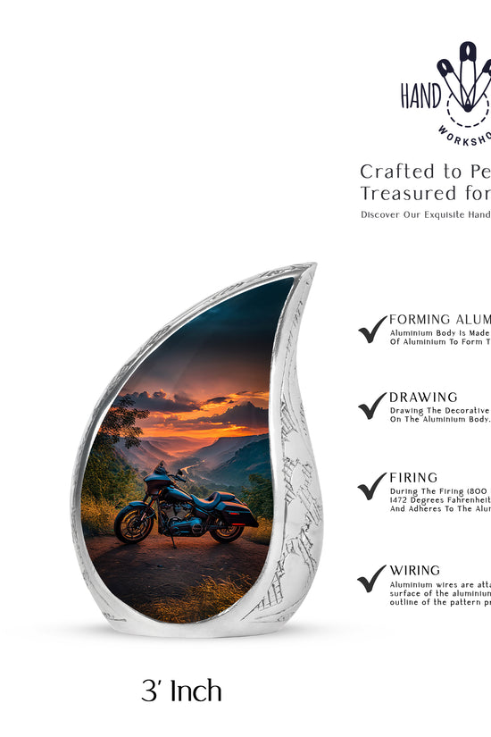 Slate Blue Bike Cremation Urn angled view of lid and engraved motif - flowing teardrop bike silhouette on curved aluminum - mini keepsake memorial for portion of cremation ashes