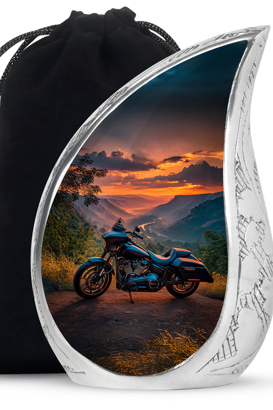 Azure Bike Cremation Urn front view showing detailed design - flowing teardrop bike silhouette on curved aluminum - full-size 10 inch 200 cubic inch adult cremation urn