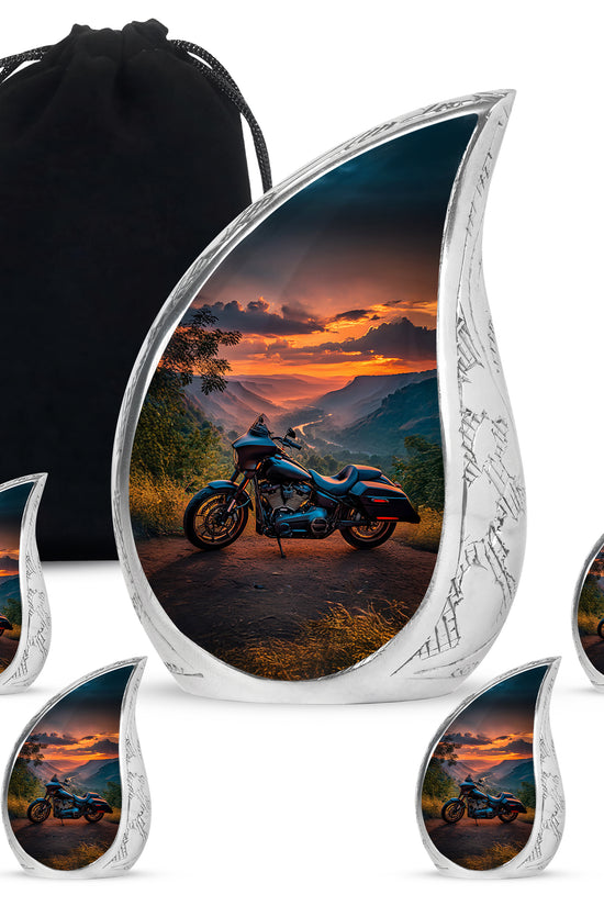 Sky Blue Bike Cremation Urn side profile showing urn shape - flowing teardrop bike silhouette on curved aluminum - memorial set with one large and four small urns