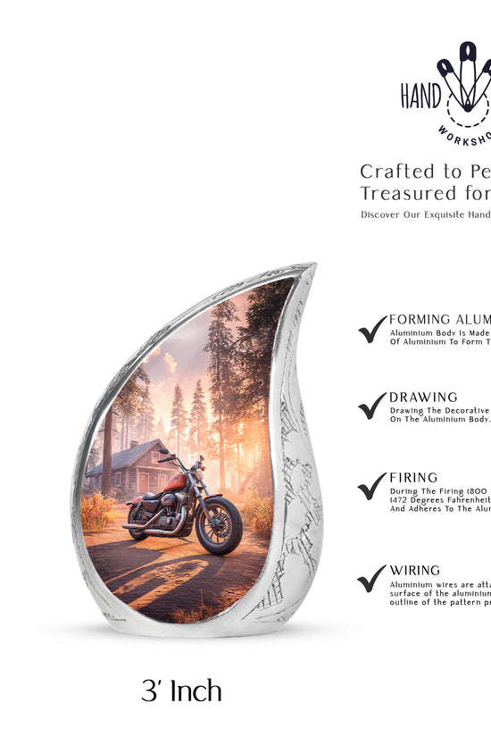 Ruby Red Bike Cremation Urn angled view of lid and engraved motif - smooth teardrop contour featuring bike art - mini keepsake memorial for portion of cremation ashes