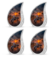Rich Black Bike Cremation Urn close-up of engraving and surface detail - rounded teardrop bike design with delicate detail - 10 inch aluminum urn for cremated remains