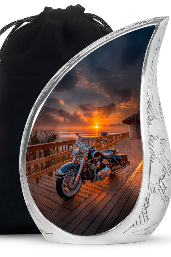 Jet Black Bike Cremation Urn front view showing detailed design - flowing teardrop bike silhouette on curved aluminum - full-size 10 inch 200 cubic inch adult cremation urn