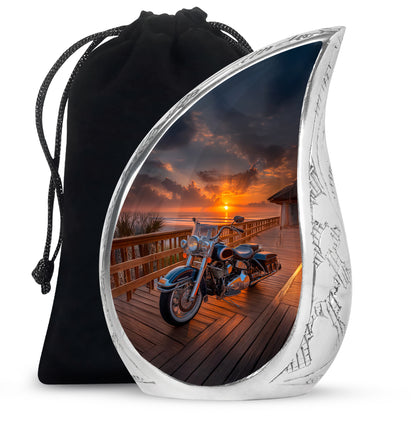 Jet Black Bike Cremation Urn front view showing detailed design - flowing teardrop bike silhouette on curved aluminum - full-size 10 inch 200 cubic inch adult cremation urn