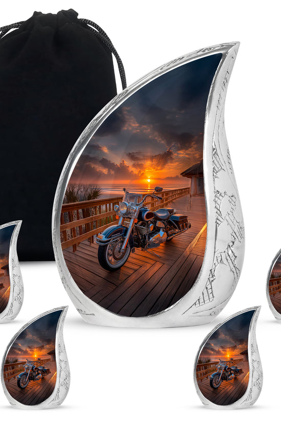 Glossy Black Bike Cremation Urn side profile showing urn shape - flowing teardrop bike silhouette on curved aluminum - memorial set with one large and four small urns