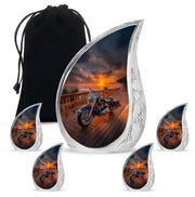 Glossy Black Bike Cremation Urn side profile showing urn shape - flowing teardrop bike silhouette on curved aluminum - memorial set with one large and four small urns