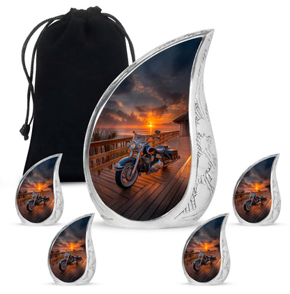 Glossy Black Bike Cremation Urn side profile showing urn shape - flowing teardrop bike silhouette on curved aluminum - memorial set with one large and four small urns