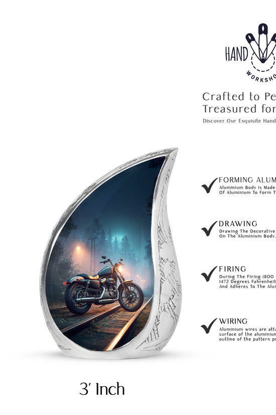 Dusty Blue Bike Cremation Urn angled view of lid and engraved motif - rounded teardrop bike design with delicate detail - mini keepsake memorial for portion of cremation ashes