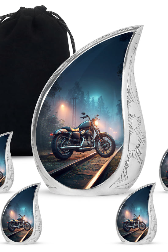 Cornflower Blue Bike Cremation Urn side profile showing urn shape - graceful tear-shaped urn with bike motif - memorial set with one large and four small urns